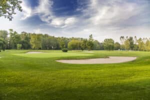 Golf courses in Phuket: Scenic golf course with sand bunkers and green.