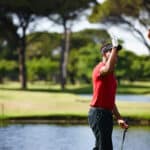 perfect golf holiday in Phuket: Two golfers high-fiving on the course.