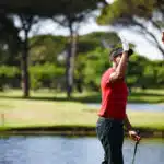 perfect golf holiday in Phuket: Two golfers high-fiving on the course.