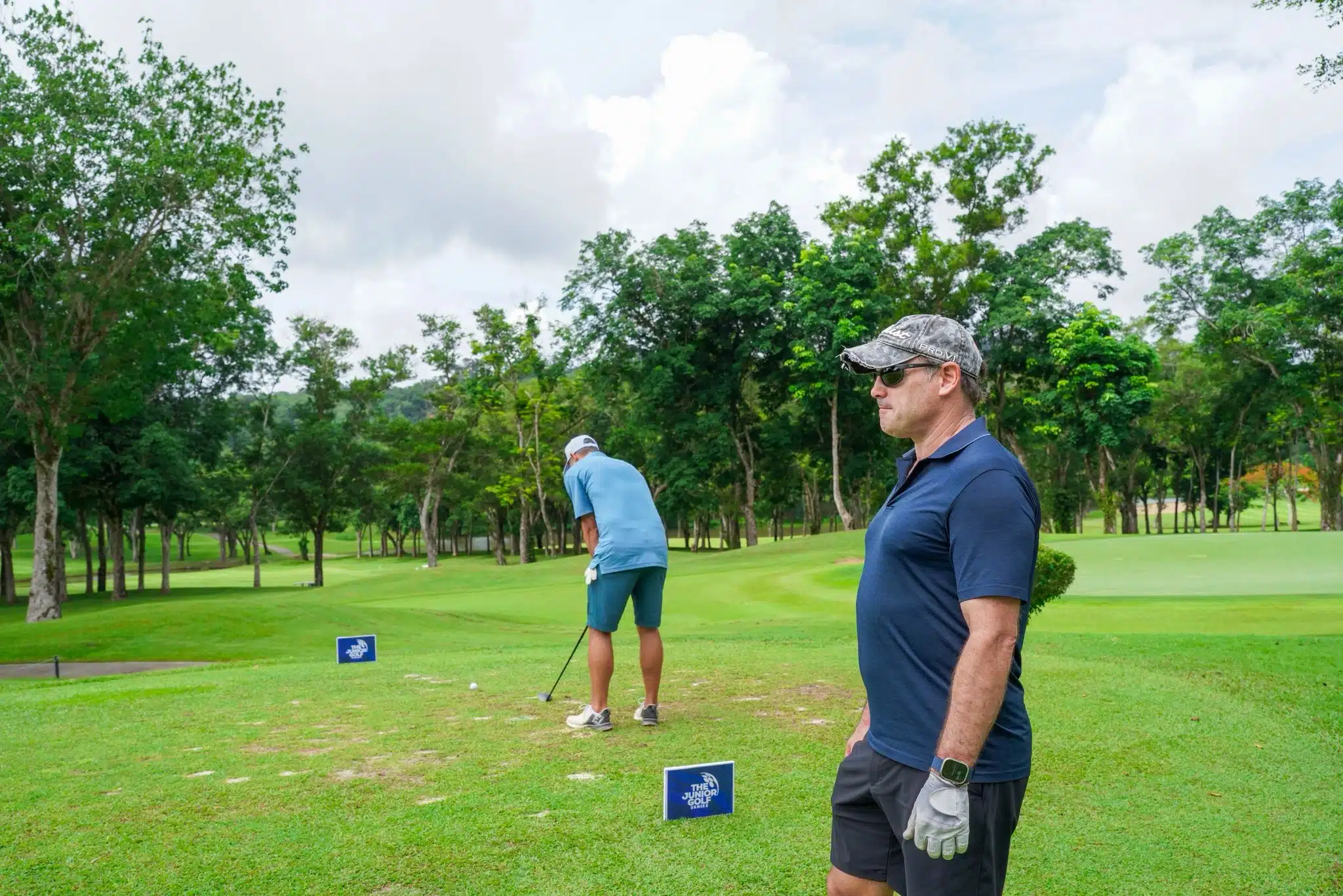 Lessons 2 An expansive aerial view of Laguna Golf Course in Phuket, showcasing vibrant fairways, water features, and nearby coastal villas.